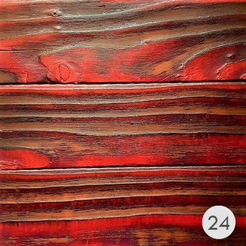 Image of different reds on burnt wood