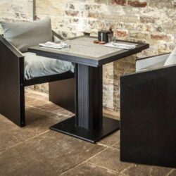 Ironfire grey bistro table with black frame in a cafe