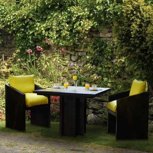 Ironfire's Bold Yellow Bistro Table with yellow cushions