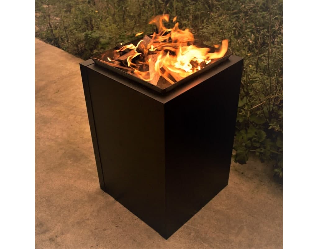 Black planter with firepit with blazing fire.