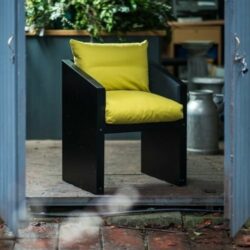 Ironfire dining chair with yellow cushions