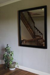 Large hung mirror in steel frame