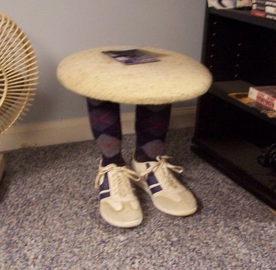 Ridiculous jokey small coffee table made of legs